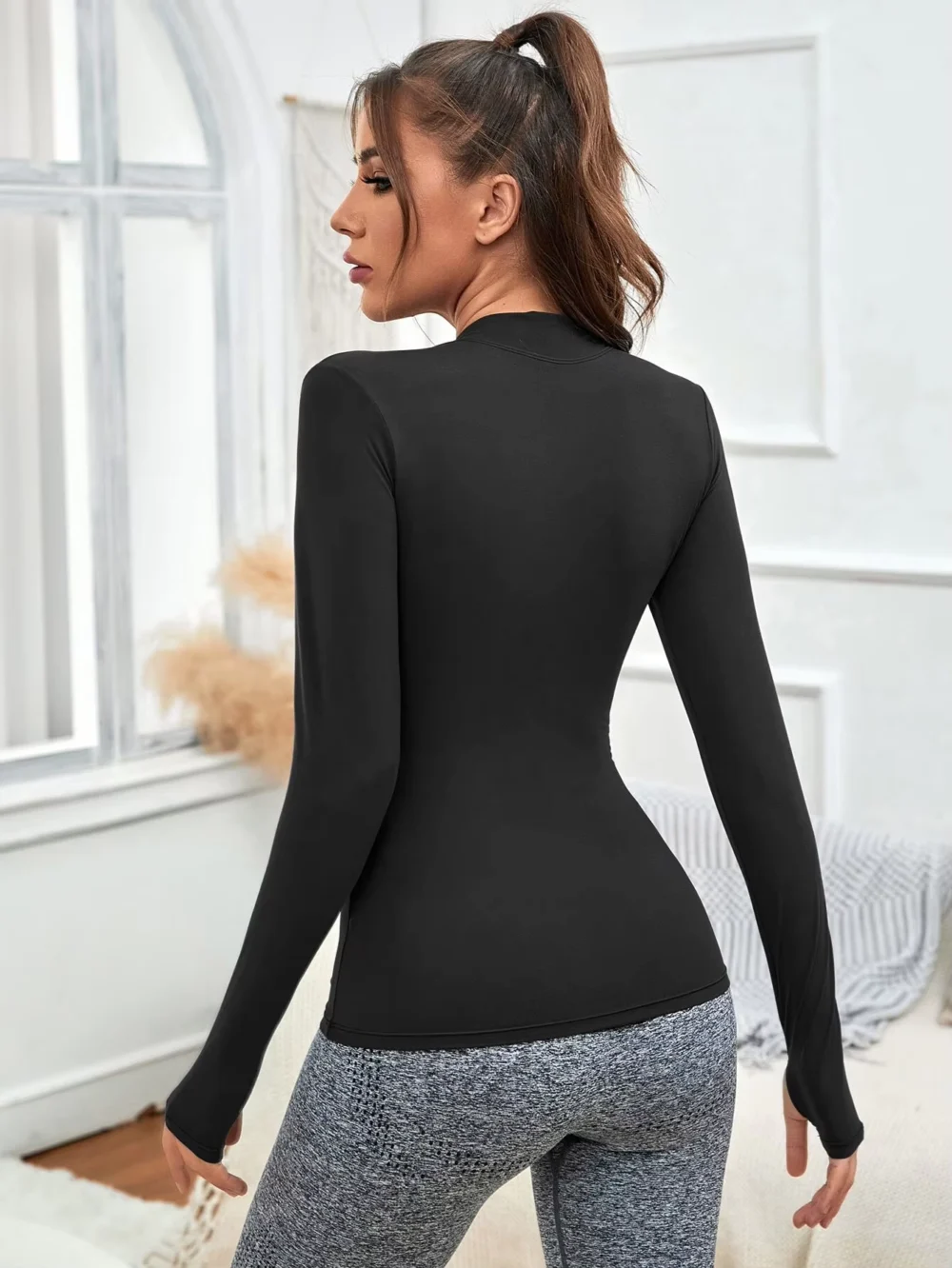Fitted Black Half-Zip Golf Top in Stretch Knit Fabric
